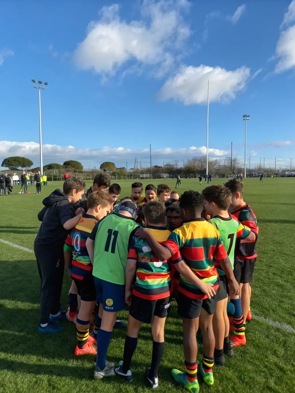 Former rugby players visiting a local school to talk about the values of teamwork, discipline, and sportsmanship, inspiring the next generation.